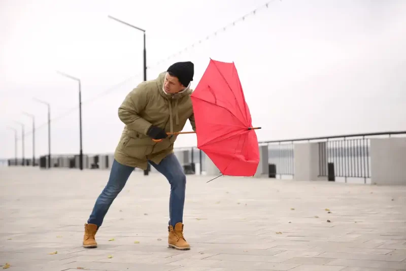man caught in wind